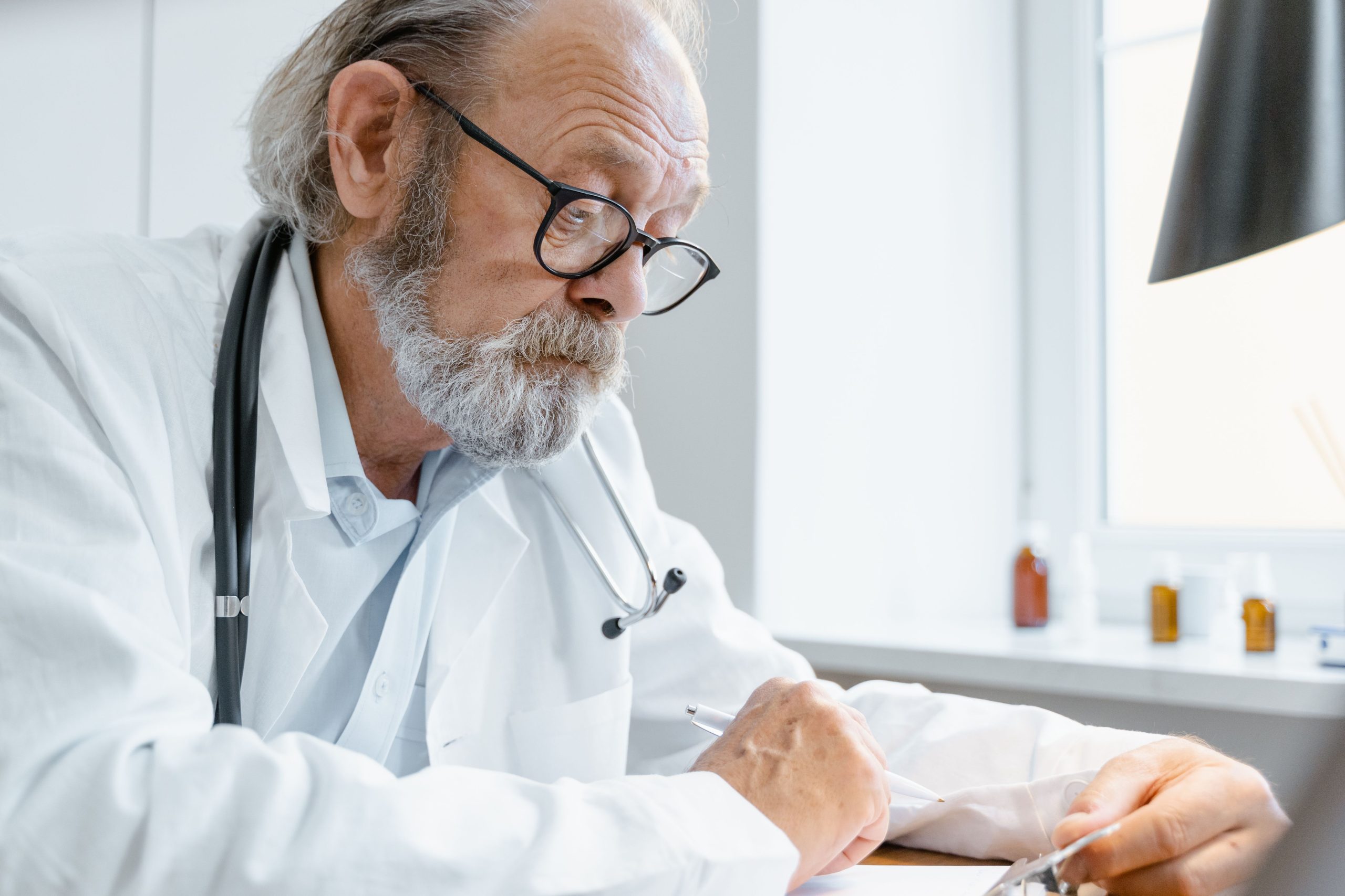 Healthcare provider documenting patient care while Altruis manages the revenue cycle